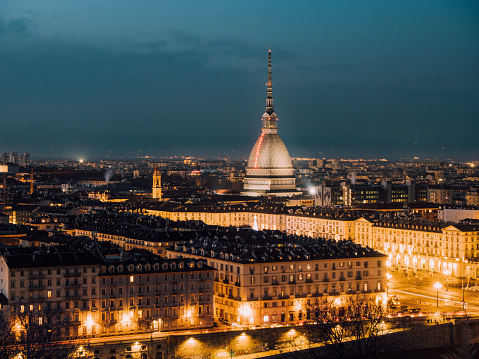 Turin skyline at sunset. Mole Antonelliana stands out in the city skyline.