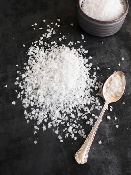 istock Heap of flake sea salt on dark background 1367312897