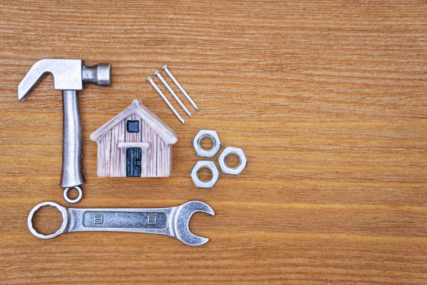 istock Miniature house with hand tools and fasteners 1367313080