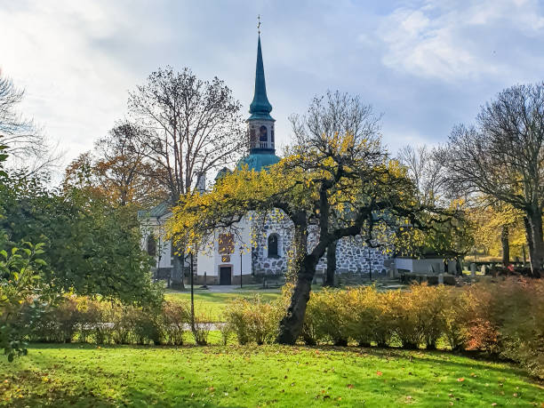 istock Apple tree in front of Bromma Church and cemetery 1367313282