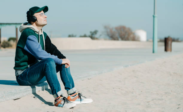istock casual middle-aged man listens to music 1367313408