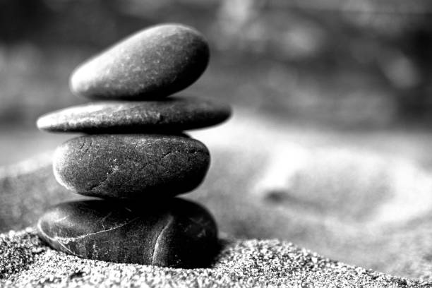 zen concept, black and white photography. various natural stones in a row. stock photo