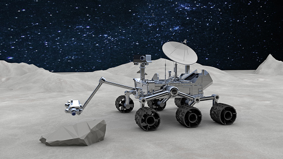 Research on the surface of Moon: New generation robotic rover on Moon ground. Lunar Rover vehicle examine a stone and aiming its cameras at the stone. After the moon landing, new drone missions became more attractive and less costly. And the moon became a popular mission again. / You can see the animation movie of this image from my iStock video portfolio. Video number: 1367104878