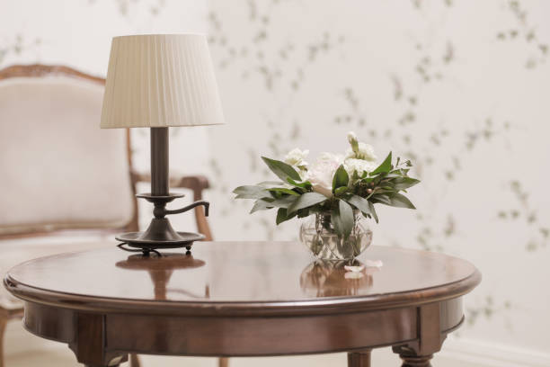 Part of interior of bedroom. Lamp on the bedside.