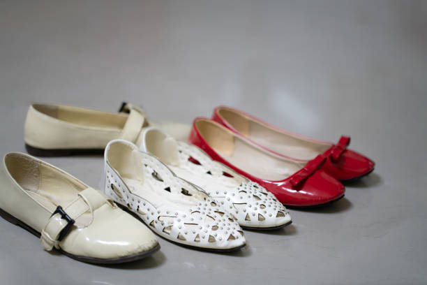 vintage worn women shoe over white, clipping path
