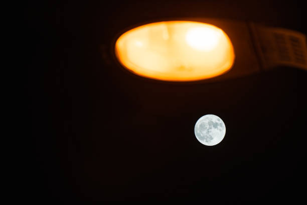 Night street lights and moon background