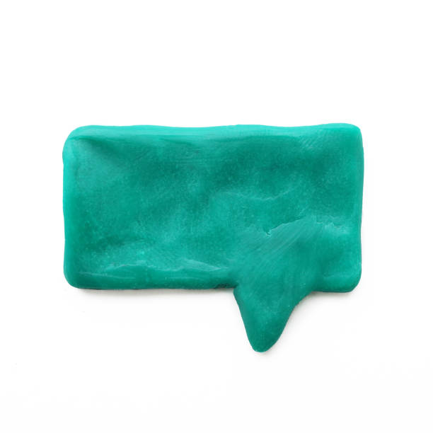 istock Green plasticine think speech bubble shape isolated on white background. Toy and hobby concept 1367320552