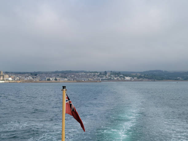 A view of Penzance harbour, Cornwall, UK from the stern of a Scilly Isles ferry.