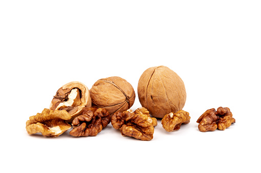 Raw and fresh walnuts, isolated on white background. Space for text.