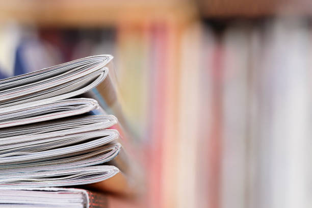 istock Stack of magazines that progressively blurs toward the right 1367323194