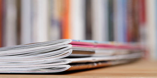 istock Stack of magazines that progressively blurs toward the right 1367323392
