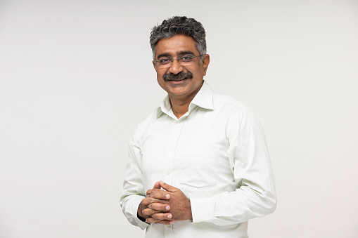 Mature businessman over white background stock photo