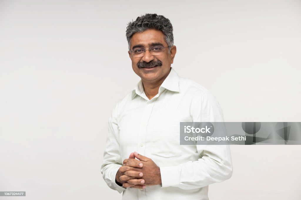 Mature businessman over white background stock photo Indian, businessman, men, background, portrait, photography, lifestyle, White Background Stock Photo