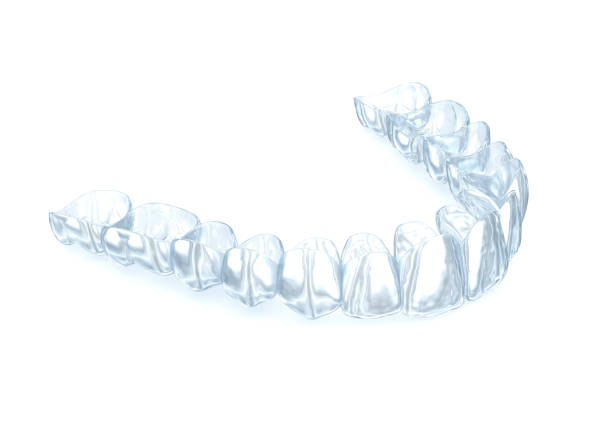 istock Invisalign braces or invisible retainer on white. Medically accurate dental 3D illustration 1367325379