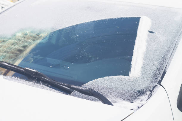 Wipers on the car clean snow from the windshield in winter Wipers on the car clean snow from the windshield in winter. windshield wiper snow stock pictures, royalty-free photos & images
