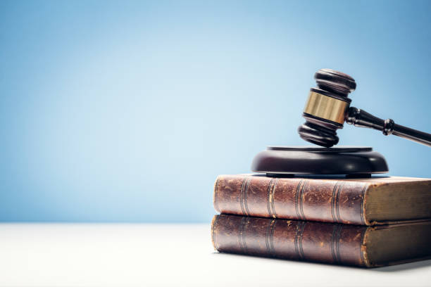 Judge gavel and law books in court background with copy space stock photo