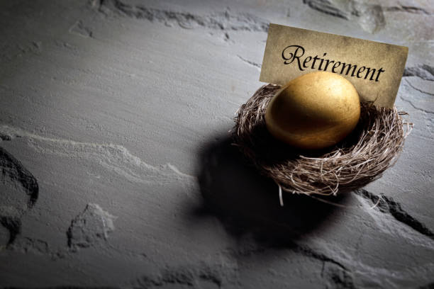 Retirement savings golden nest egg background Golden nest egg background concept for retirement savings golden nest egg taxes stock pictures, royalty-free photos & images