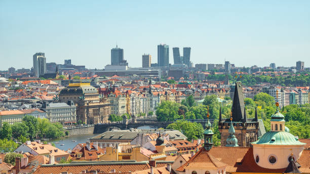 istock Panoramic view over beautiful old town with Charles Bridge Tower Gateway through river Vltava and new modern business district with skyscrapers in Prague, Czech Republic. 1367326533