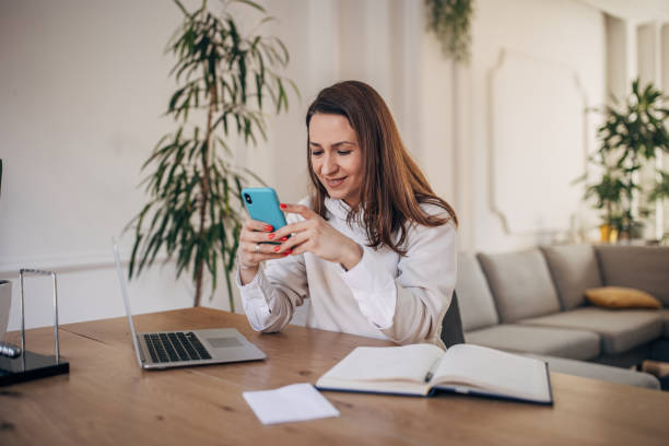 istock Modern woman using smart phone 1367326586