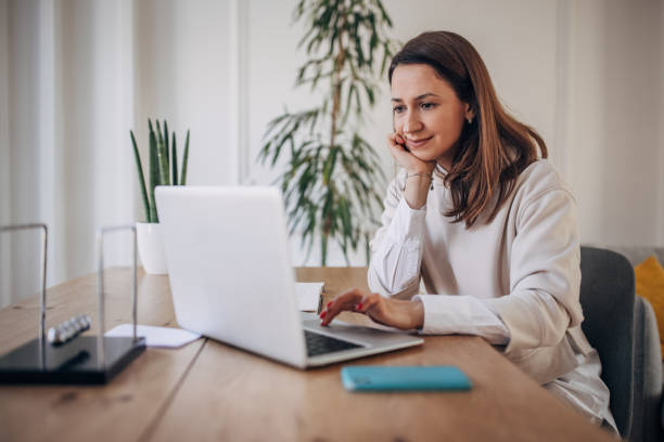istock Businesswoman working on laptop 1367326666