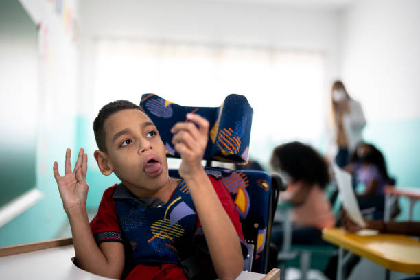 istock Boy with special needs in the classroom 1367327981