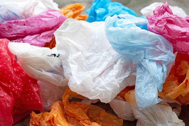 istock Colorful plastic bags on cement floor 1367328062
