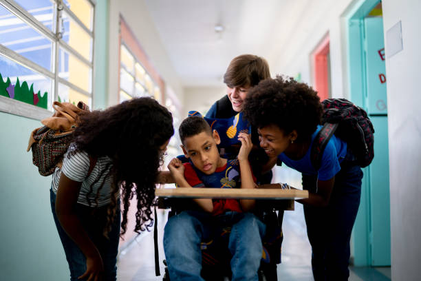 istock Kids walking in the corridor with disability boy at school 1367328082