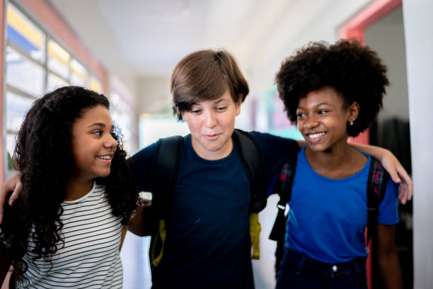 istock Kids talking and walking in the corridor at school 1367328086