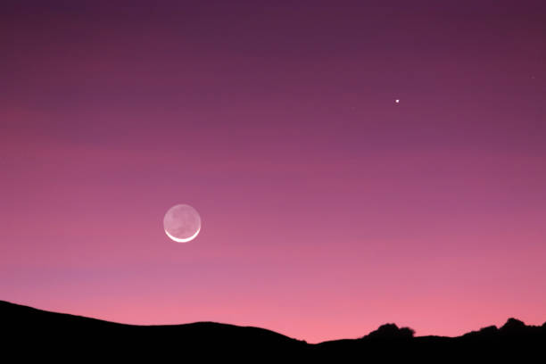 istock Beautiful and heavenly sunset with the tender moon 1367328318