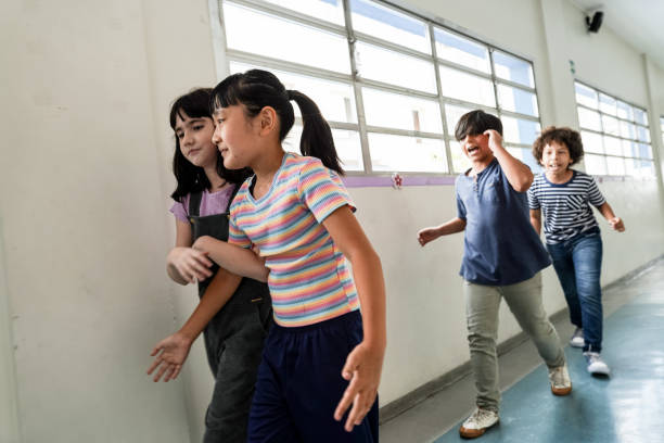 istock Kids running in the corridor at school 1367328441