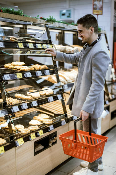 istock Man choice bread in the supermarket 1367328544