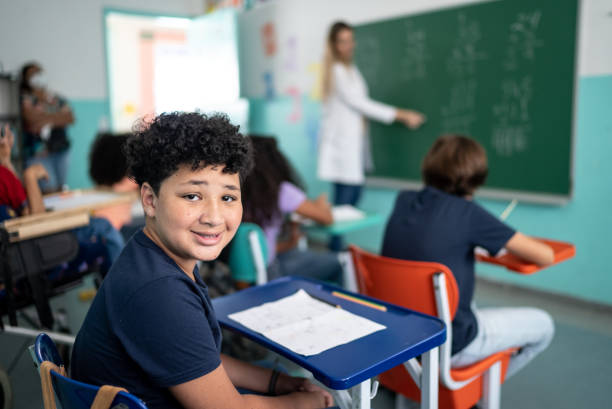 istock Portrait of a boy studying in the classroom 1367329399