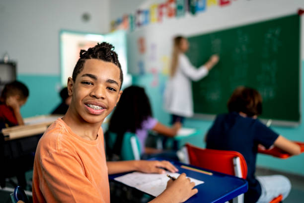 istock Portrait of a boy studying in the classroom 1367329425