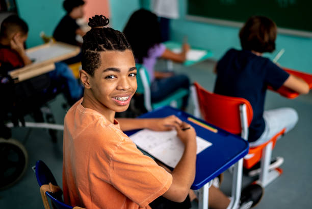 istock Portrait of a boy studying in the classroom 1367329436