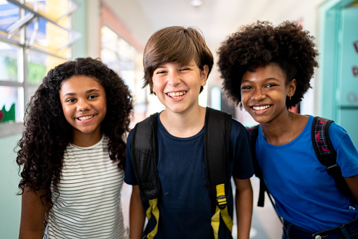 Portrait of kids in the corridor at school