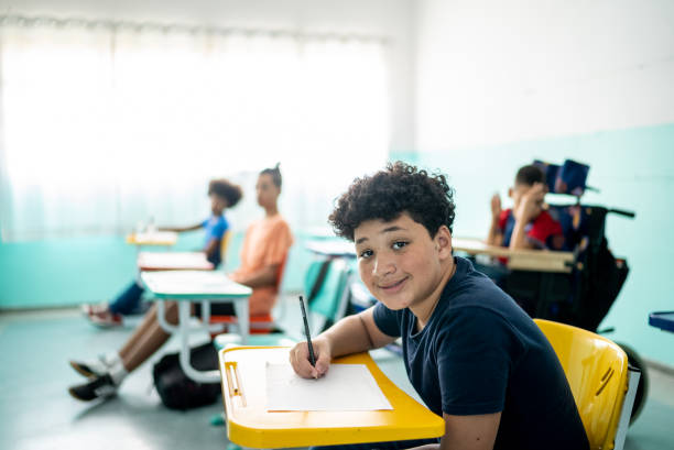 istock Portrait of a boy studying in the classroom 1367329446