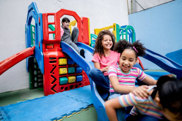 istock Girls playing in the playground 1367329452