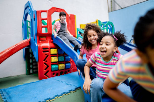 istock Girls playing in the playground 1367329462