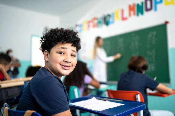 istock Portrait of a boy studying in the classroom 1367329474