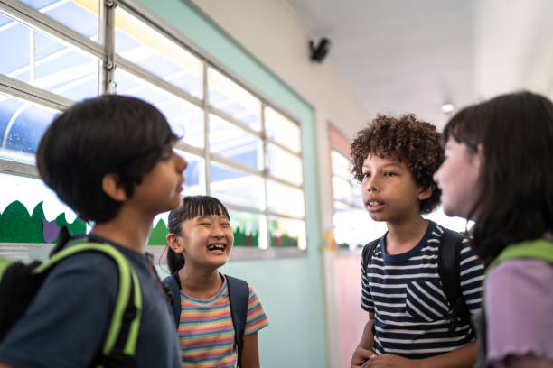 istock Kids talking in the corridor at school 1367329805