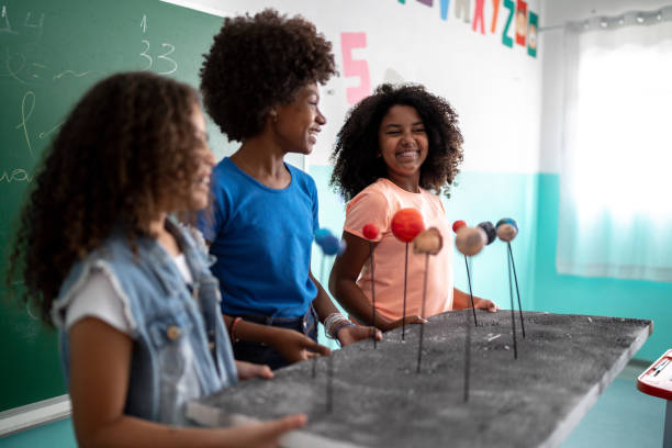A group of student listening about a science experiment