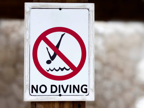 istock Don't dive. Prohibition sign on the resort beach. 1367330758