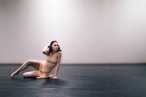Young girl performing contemporary dance on stage. Canon Mark IV.