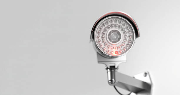 istock Modern surveillance camera with an infrared light inserted in it from the front side in close up on a withe background 1367332525