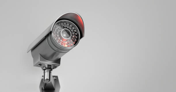 istock Modern surveillance camera with an infrared light inserted in it directed upwards in close up on a withe background 1367332528