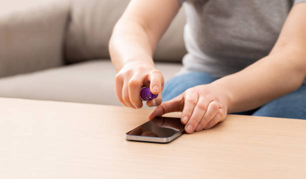 istock woman cleaning her mobile phone 1367332726