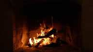 istock A Looping Clip of a Fireplace with Medium Size Flames Burning Fire. 1367334336