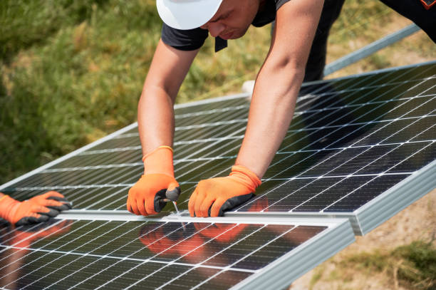 istock Male worker mounting photovoltaic solar panel system outdoors. 1367335211