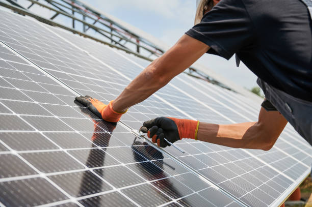 istock Male worker hands installing solar panels outdoors. 1367335259
