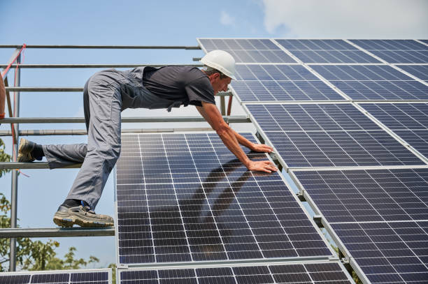 istock Male worker mounting photovoltaic solar panel system outdoors. 1367335308